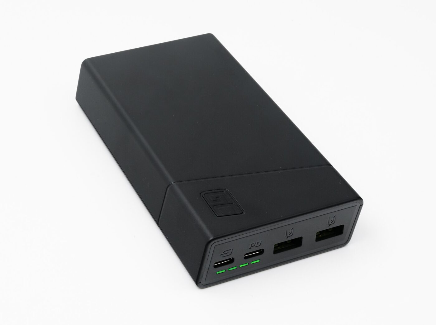 A black portable power bank with USB-C and USB-A ports and green charge indicator lights