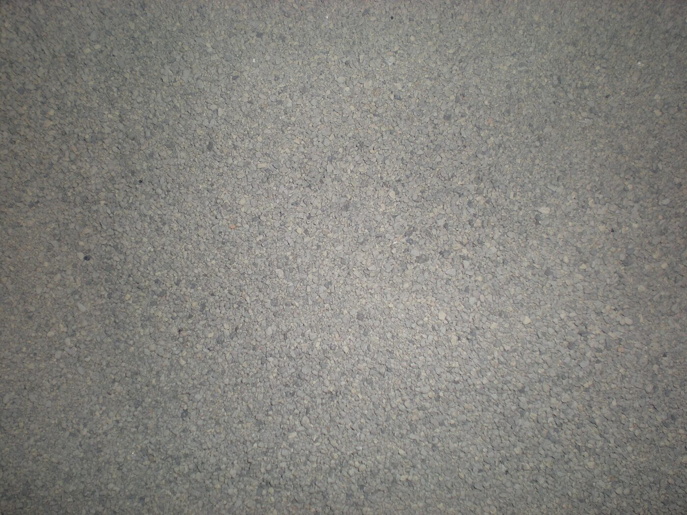 A close-up of fresh, unused gray cat litter granules.