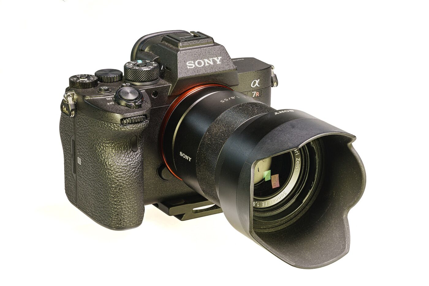 A full-frame mirrorless camera with a fixed focal length lens mounted, seen from the front.