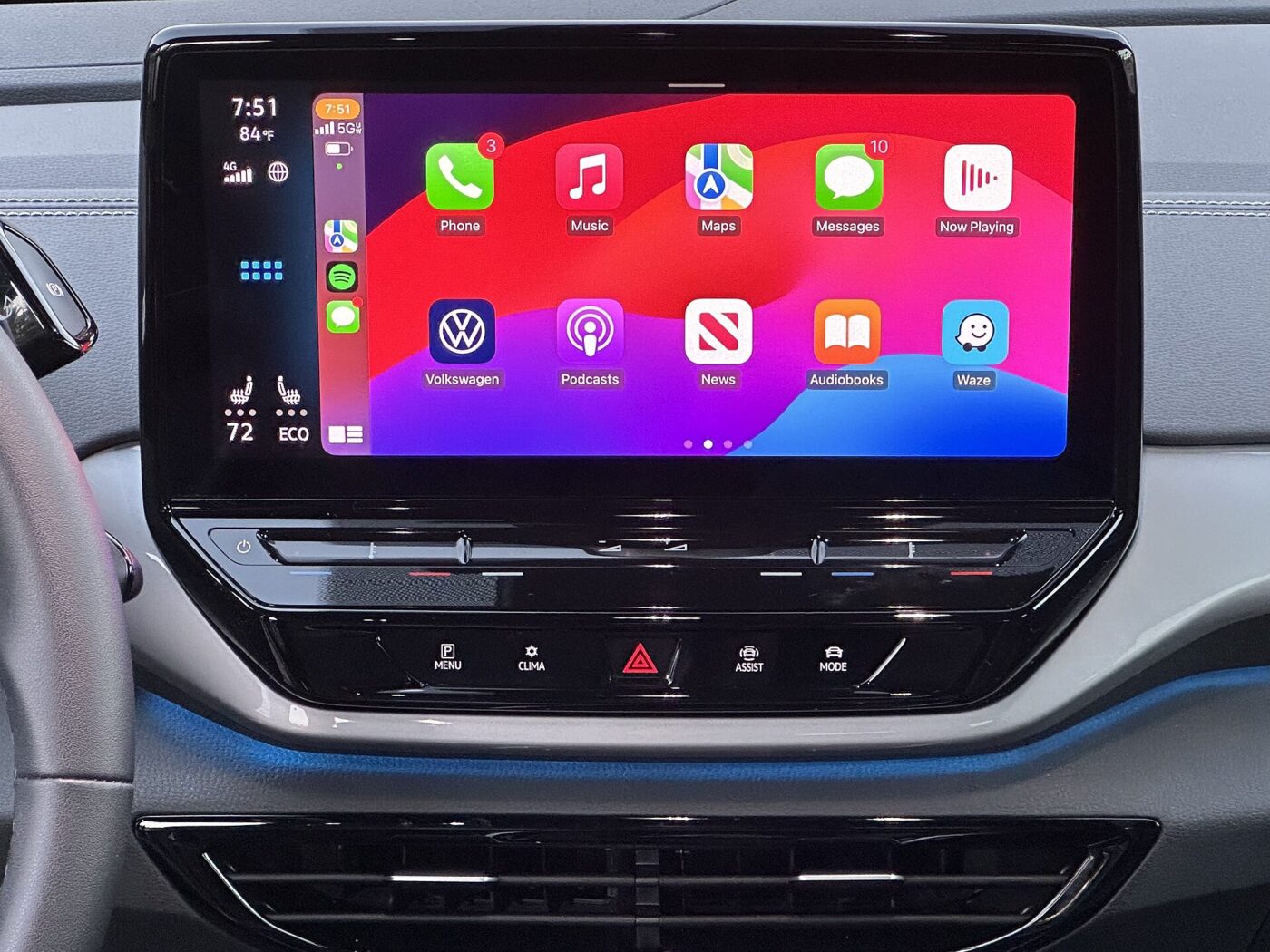 Apple CarPlay's home screen of app icons on a car's wide center touchscreen