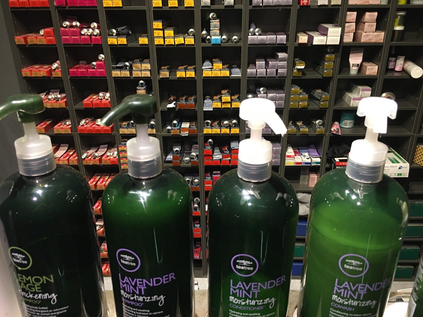 Pump bottles of hair care products lined up for sale