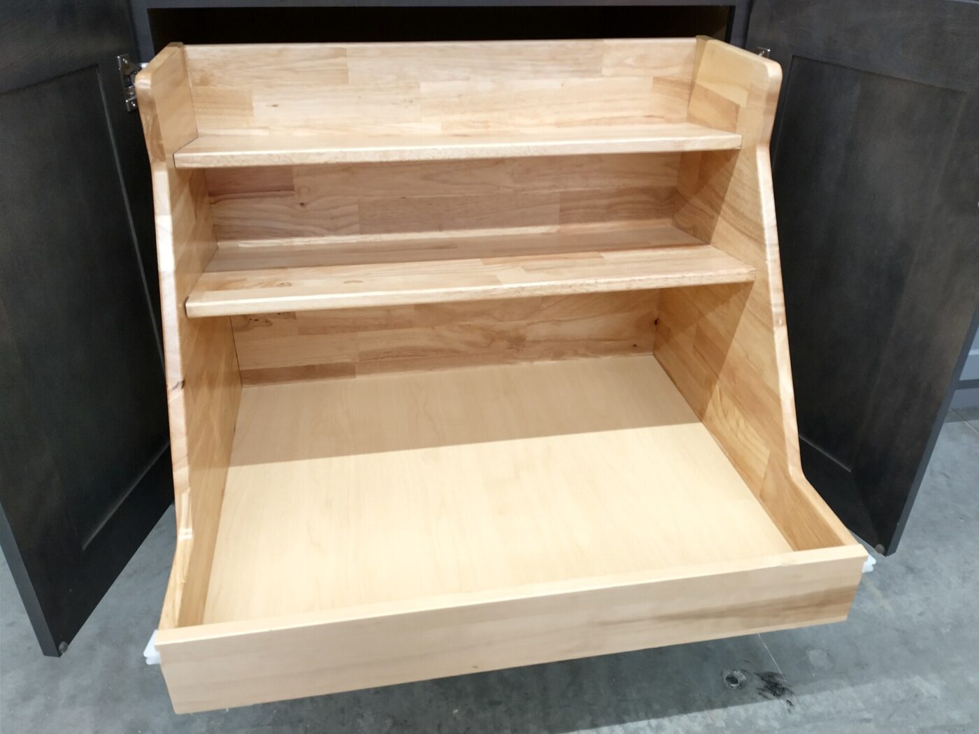 An unfinished wooden cabinet box with a fixed shelf and a pull-out drawer