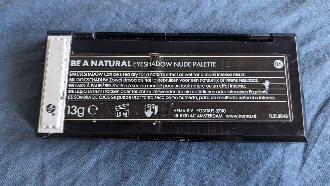 The printed label on the back of a closed drugstore eyeshadow palette