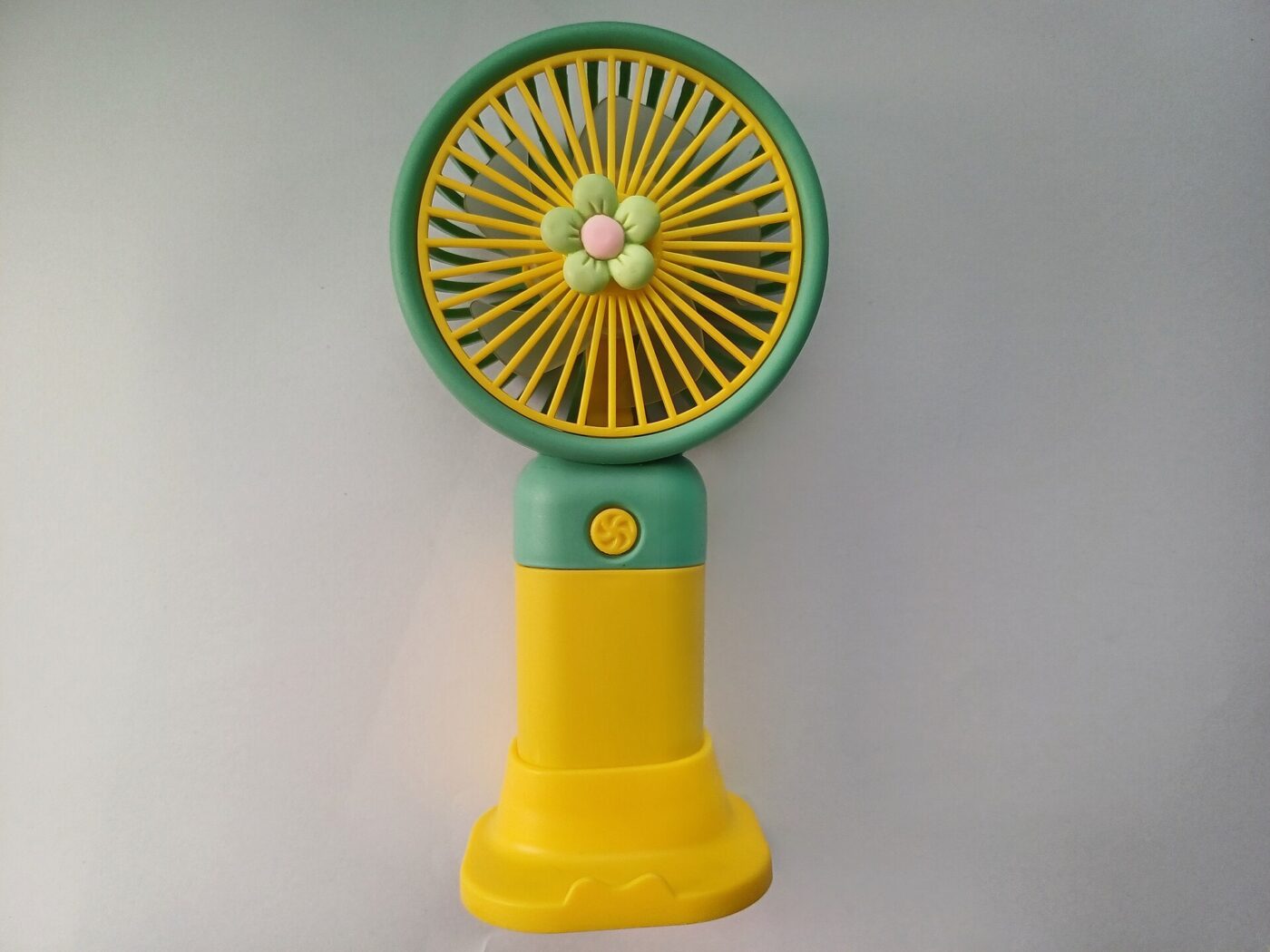 A small rechargeable battery-powered fan standing upright against a plain white background.