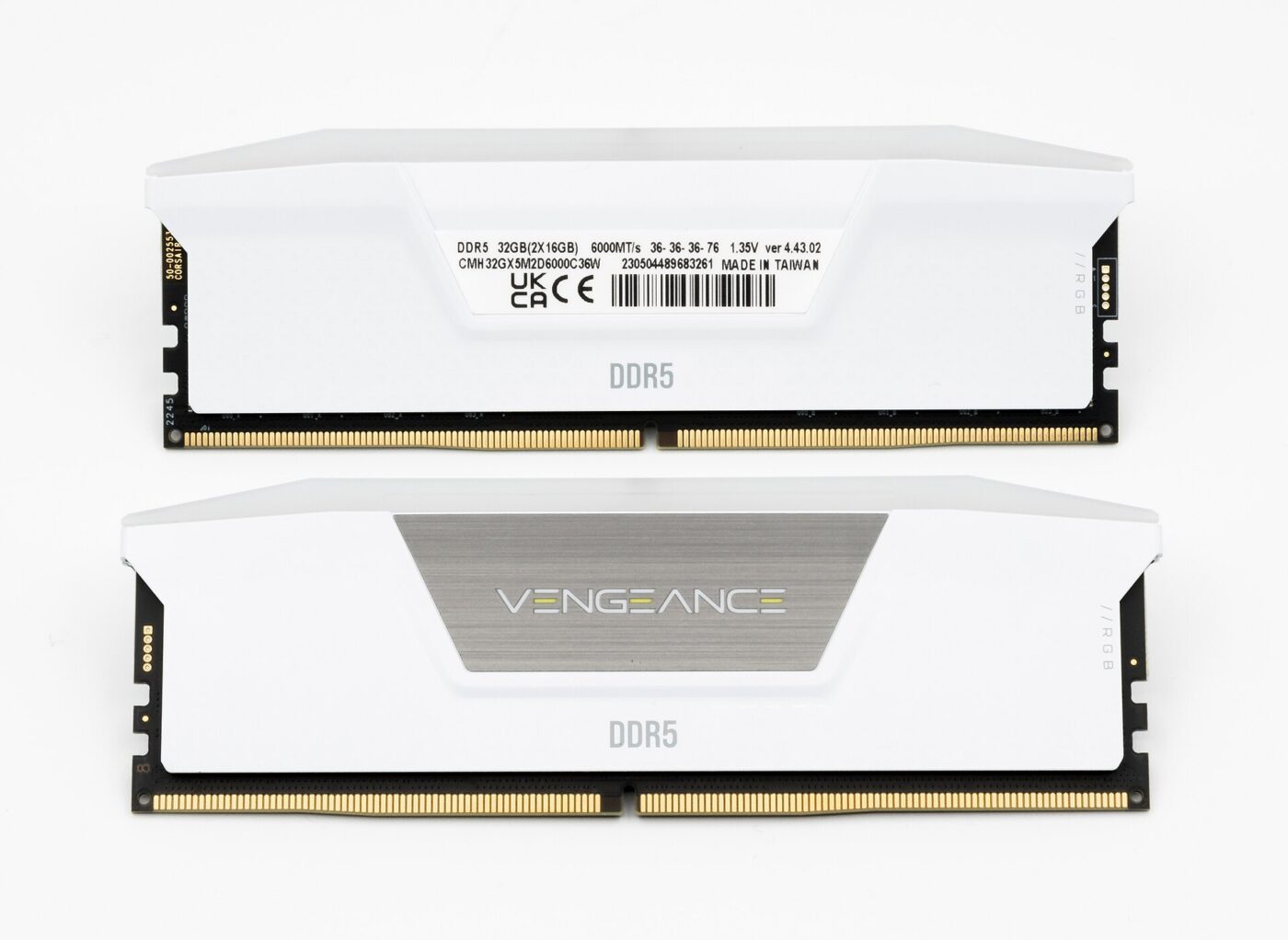 A two-module 32GB DDR5-6000 memory kit with white heat spreaders on a white background
