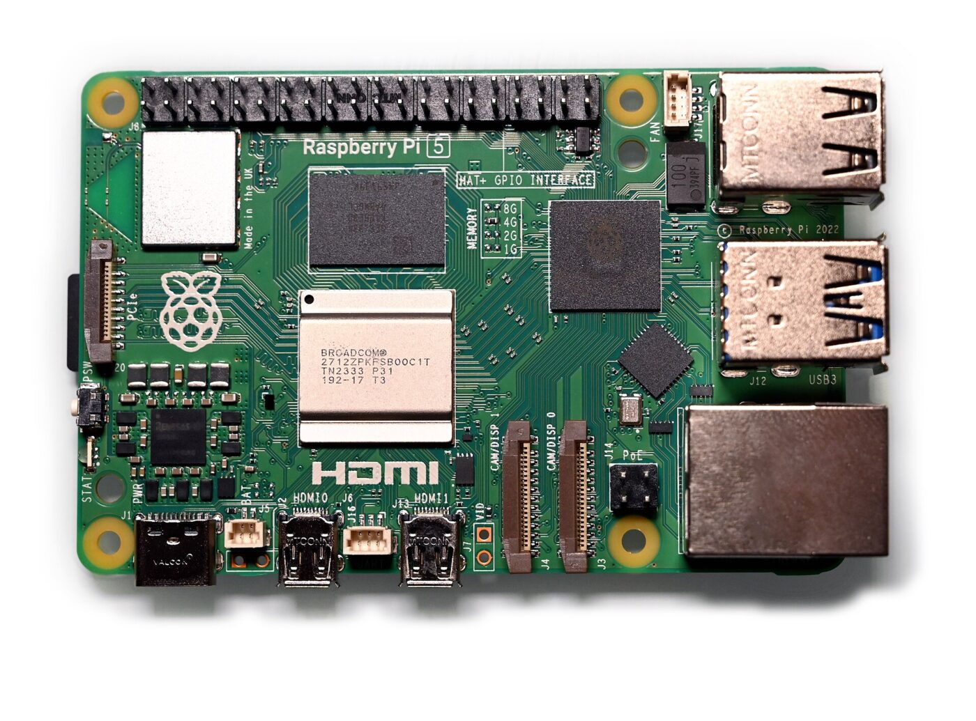 Top view of a Raspberry Pi 5 single-board computer with its processor, memory chip and ports