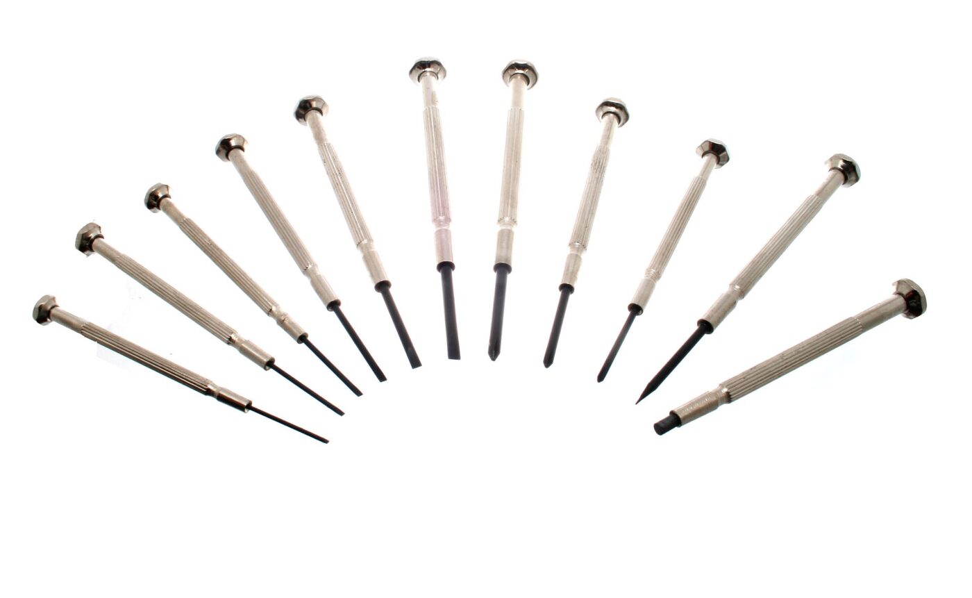 A set of eleven precision screwdrivers with knurled metal handles fanned out on a white background