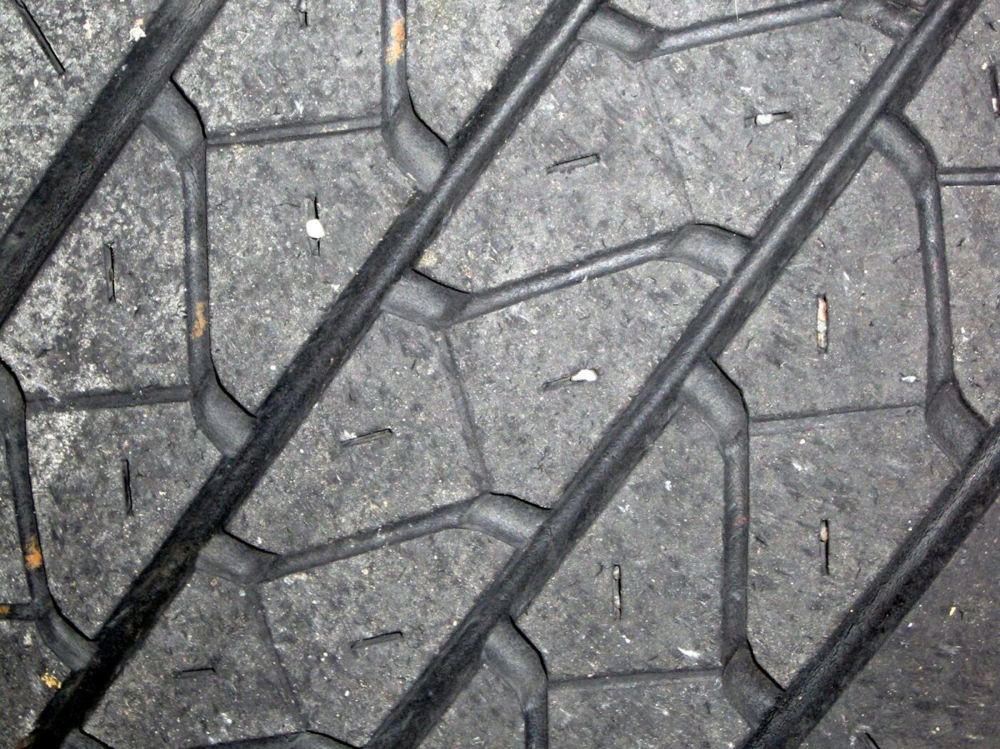Close-up of the deep tread blocks and grooves on a vehicle tire