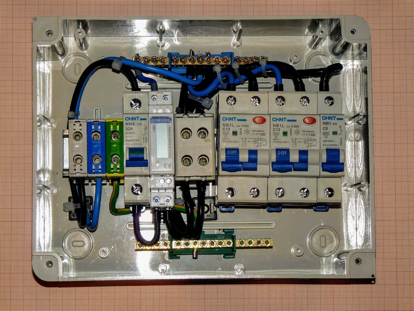 Miniature circuit breakers and their wiring inside an opened electrical distribution panel