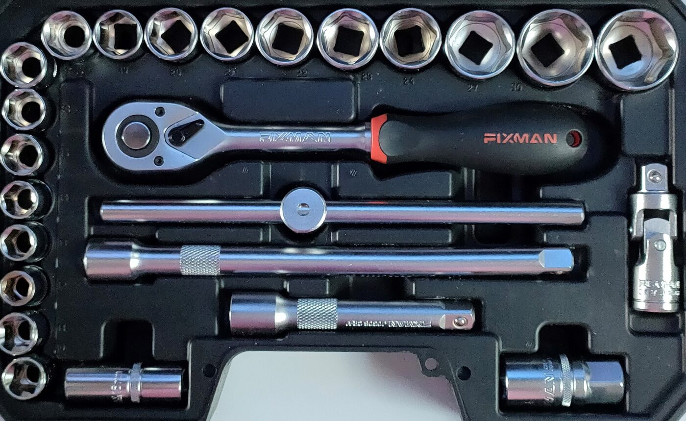 An open tool case holding chrome sockets, extension bars and a ratchet handle.