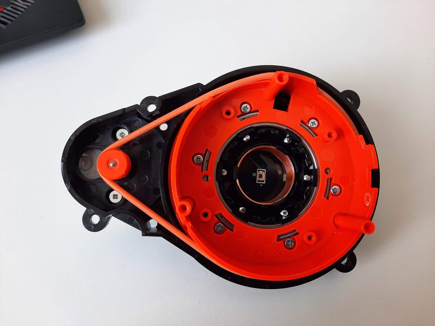 The bearing and drive motor that spin the mirror inside a laser distance sensor.